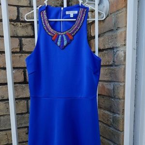 Women Spence dress, blue with decorated neck line.
